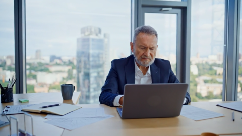 man typing on computer